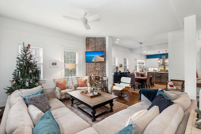 living room with hardwood / wood-style flooring and ceiling fan