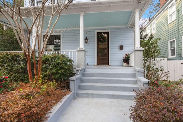 doorway to property featuring covered porch