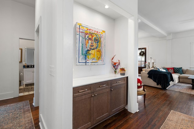 corridor with dark hardwood / wood-style flooring