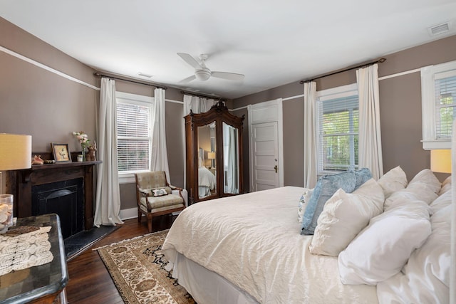 bedroom featuring dark hardwood / wood-style floors and ceiling fan