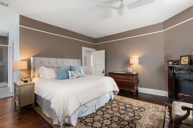 bedroom with ceiling fan and dark wood-type flooring