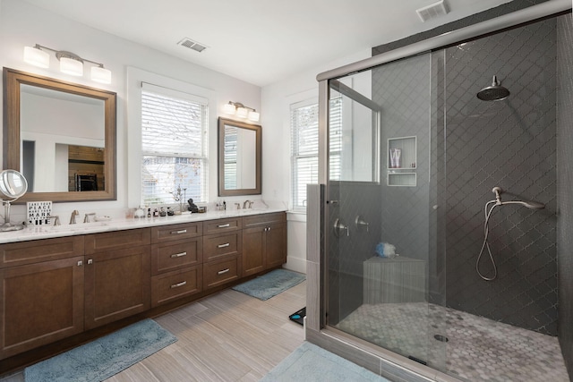 bathroom featuring vanity and walk in shower