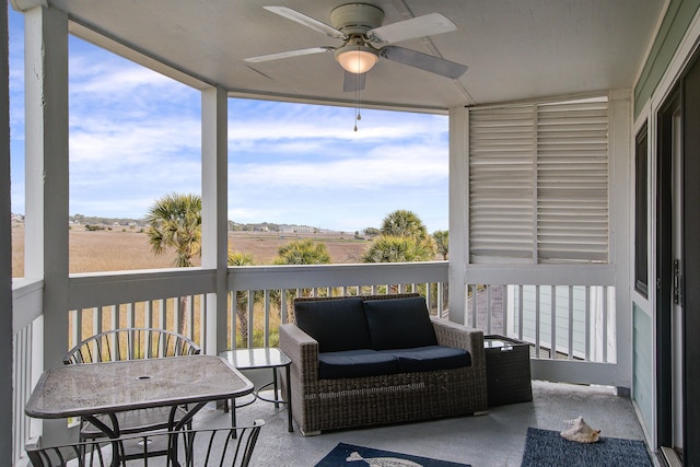 sunroom / solarium with plenty of natural light and a ceiling fan