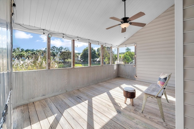 unfurnished sunroom with lofted ceiling and ceiling fan