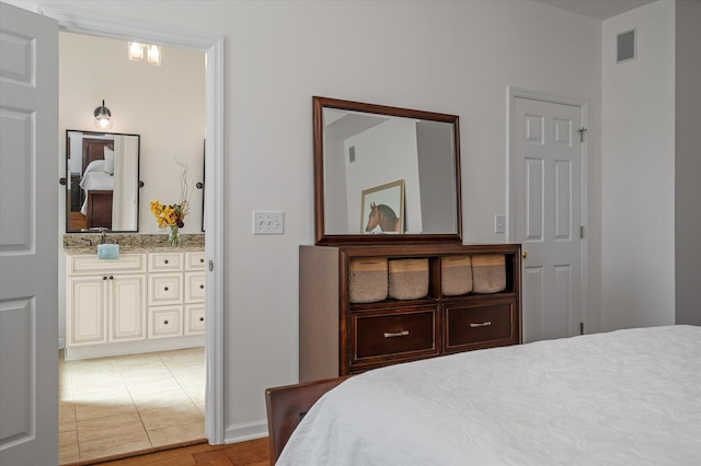 bedroom with light tile patterned floors