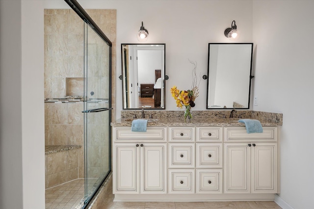 bathroom featuring vanity and walk in shower