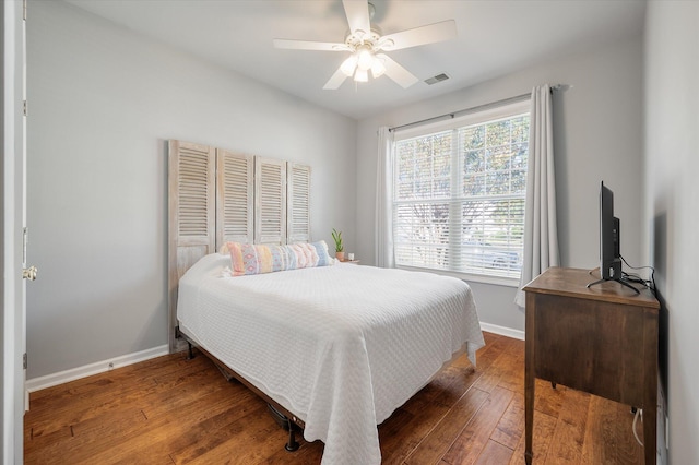 bedroom featuring dark wood-type flooring and ceiling fan