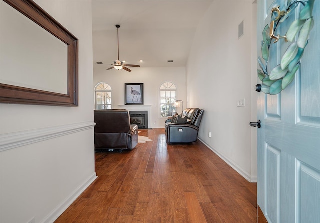 interior space with dark hardwood / wood-style floors and ceiling fan