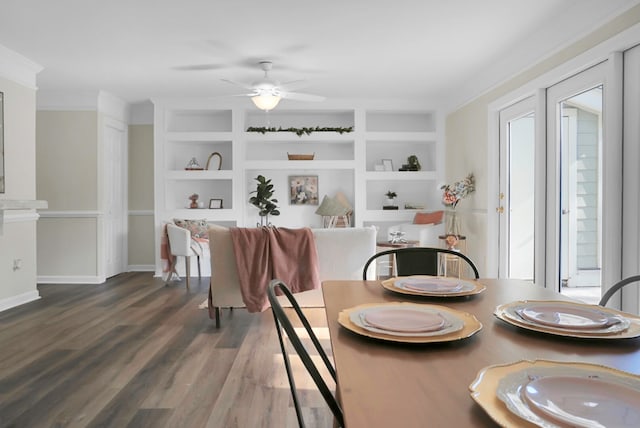 dining room with ceiling fan, dark hardwood / wood-style floors, and built in shelves