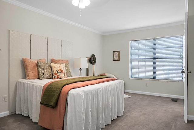 bedroom with crown molding and carpet