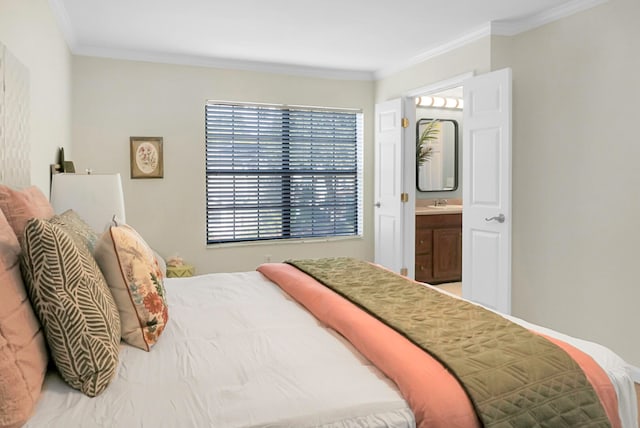 bedroom featuring connected bathroom, ornamental molding, and sink