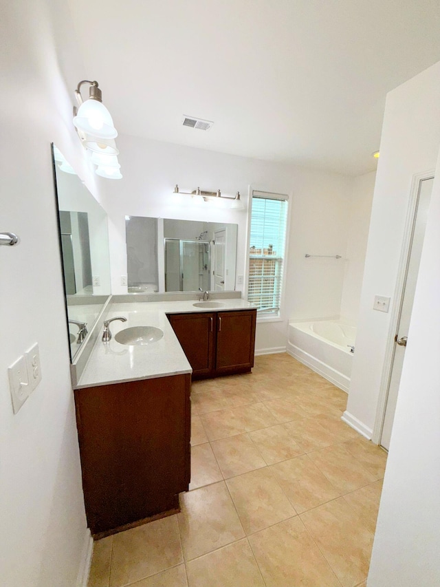 332 Southern Sugar Ave, Moncks Corner, SC 29461 - full bath with tile patterned floors, a stall shower, a bath, and two vanities