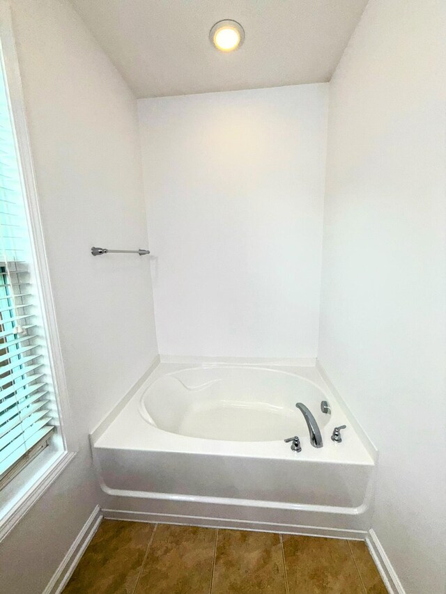 332 Southern Sugar Ave, Moncks Corner, SC 29461 - bathroom with tile patterned floors, a garden tub, and baseboards