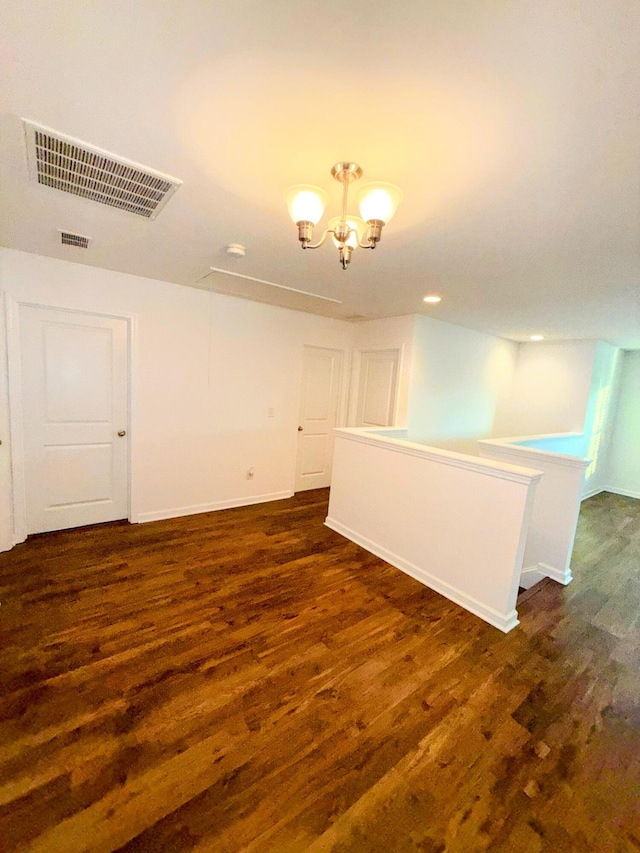 332 Southern Sugar Ave, Moncks Corner, SC 29461 - empty room featuring dark wood-style floors, a chandelier, and baseboards