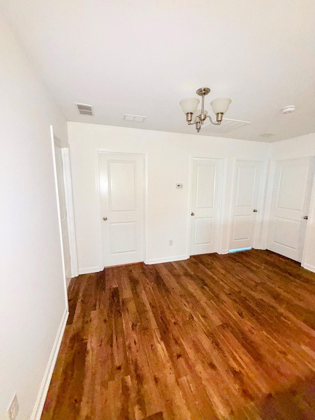 332 Southern Sugar Ave, Moncks Corner, SC 29461 - unfurnished room with wood finished floors, a chandelier, and baseboards