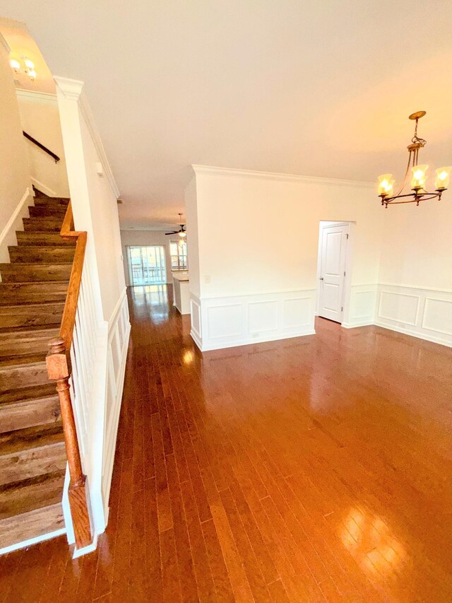 332 Southern Sugar Ave, Moncks Corner, SC 29461 - unfurnished room featuring a decorative wall, a chandelier, stairway, crown molding, and wood finished floors
