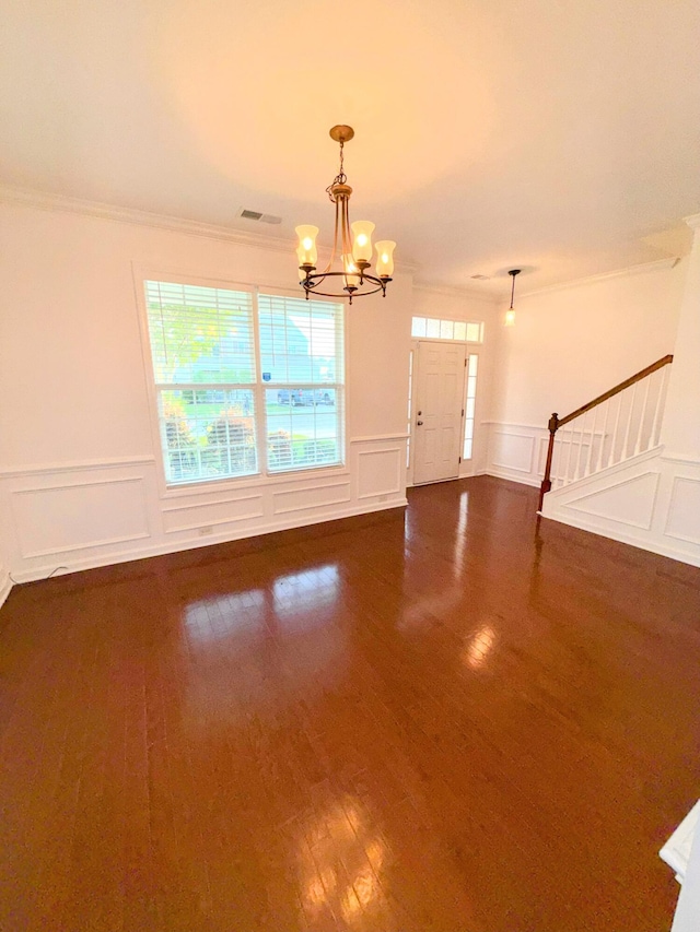 332 Southern Sugar Ave, Moncks Corner, SC 29461 - entrance foyer with a chandelier, dark wood finished floors, ornamental molding, stairs, and a decorative wall