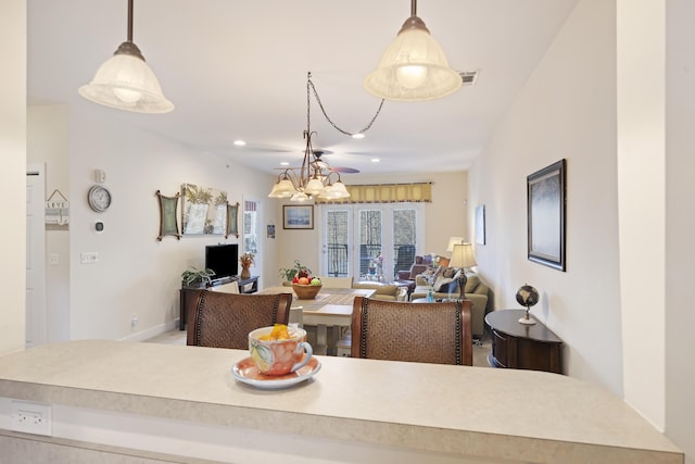 dining space featuring a notable chandelier