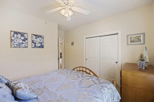 bedroom featuring ceiling fan and a closet