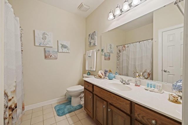 bathroom with tile patterned floors, vanity, and toilet