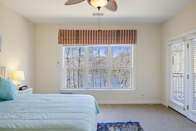 bedroom with ceiling fan, access to exterior, and carpet floors