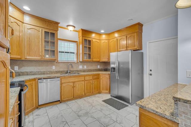 kitchen with tasteful backsplash, stainless steel appliances, light stone countertops, and sink