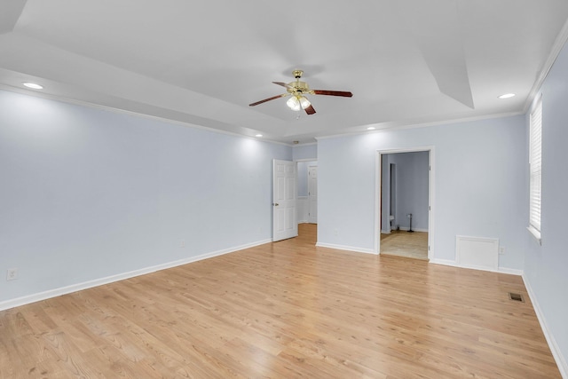 spare room with ceiling fan, ornamental molding, light hardwood / wood-style floors, and a wealth of natural light