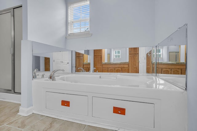 bathroom featuring separate shower and tub