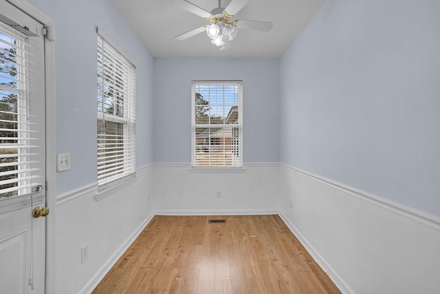 spare room featuring ceiling fan and light wood-type flooring