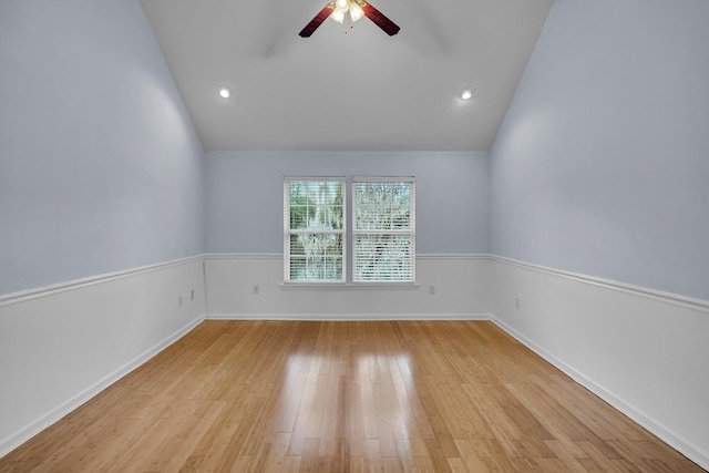 unfurnished room featuring lofted ceiling, light hardwood / wood-style flooring, and ceiling fan