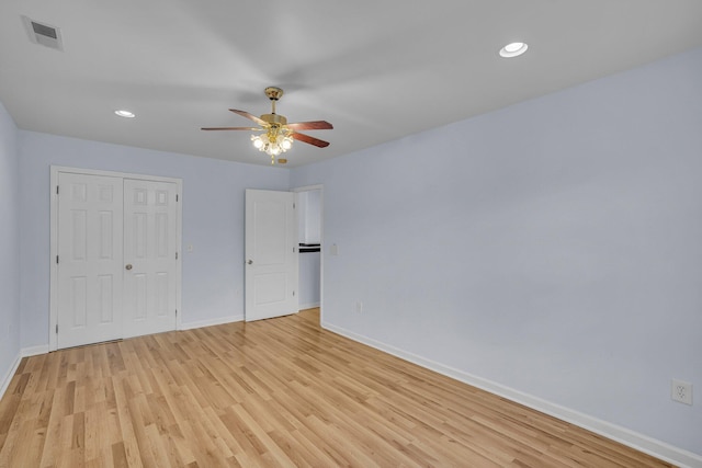 unfurnished bedroom featuring a closet, ceiling fan, and light hardwood / wood-style floors