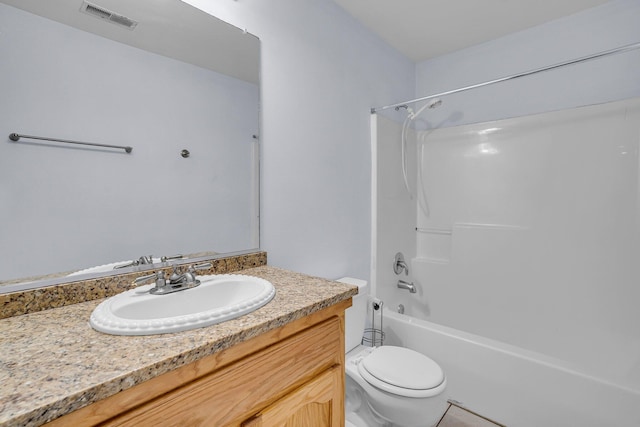 full bathroom featuring  shower combination, vanity, and toilet