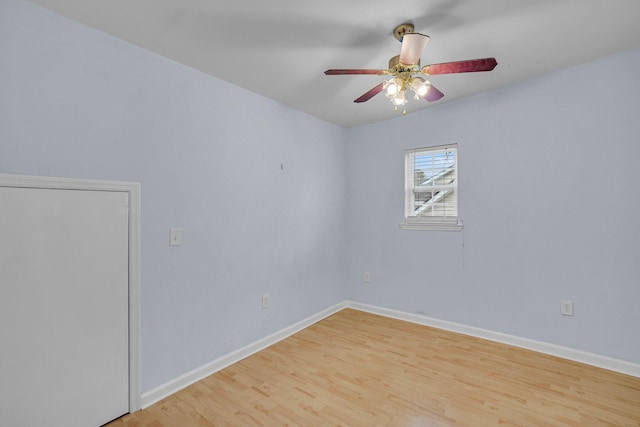 unfurnished room with ceiling fan and light wood-type flooring