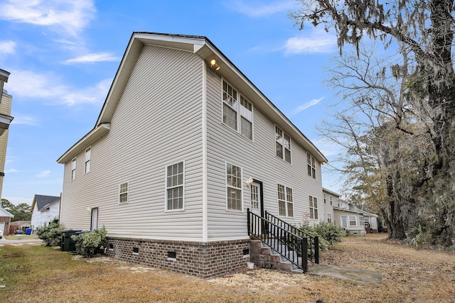 view of side of property featuring central AC unit