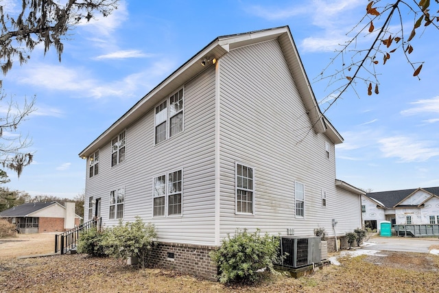 view of side of property with central AC