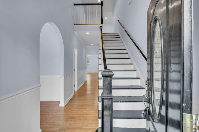 entryway with hardwood / wood-style flooring