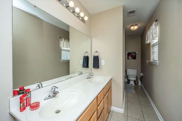 full bathroom featuring tile patterned flooring, a sink, and visible vents