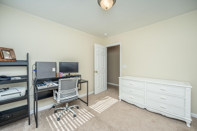 office space with light carpet and baseboards