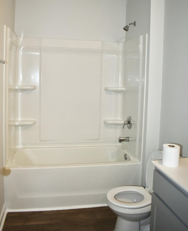 full bath with vanity, toilet, shower / bathing tub combination, and wood finished floors