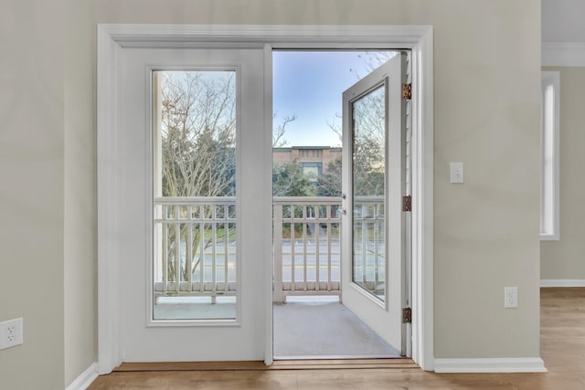 doorway with light hardwood / wood-style floors