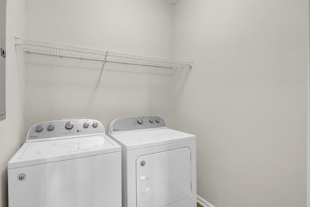 clothes washing area with washing machine and clothes dryer