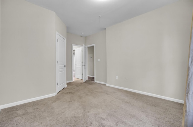 unfurnished bedroom featuring light colored carpet