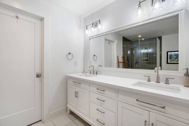 bathroom featuring tile patterned floors, vanity, and a shower with shower door