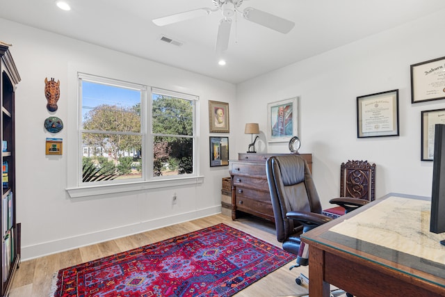 office space with ceiling fan and light wood-type flooring