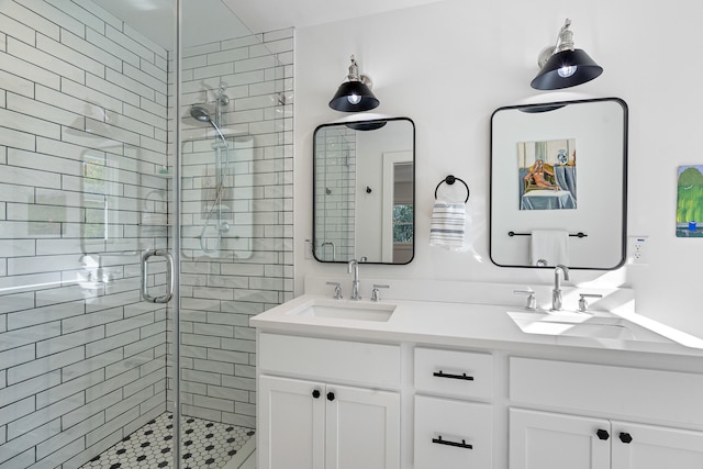 bathroom featuring vanity and a shower with door