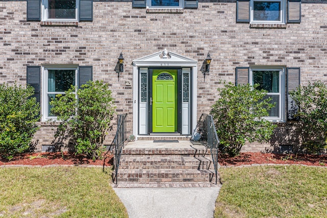 entrance to property with a yard