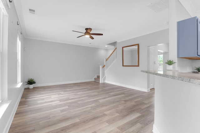 5242 E Dolphin St, North Charleston, SC 29405 - unfurnished living room with ceiling fan, stairway, light wood-style floors, and ornamental molding