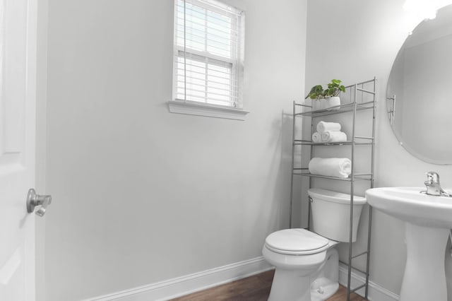 5242 E Dolphin St, North Charleston, SC 29405 - half bath featuring baseboards and wood finished floors