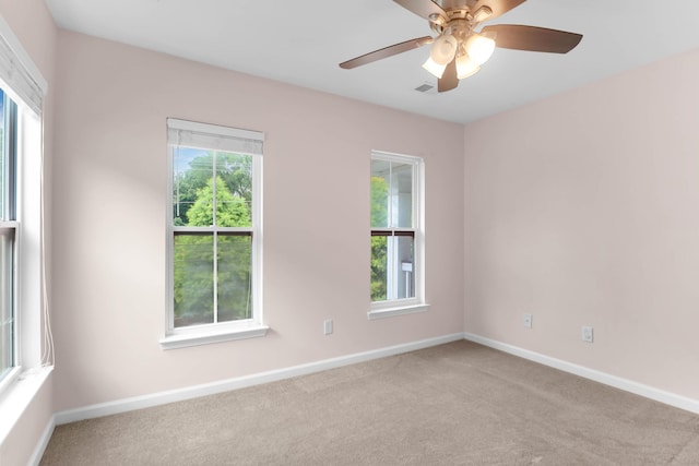 5242 E Dolphin St, North Charleston, SC 29405 - carpeted empty room with healthy amount of natural light and a ceiling fan