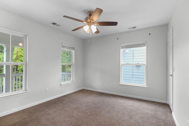 5242 E Dolphin St, North Charleston, SC 29405 - unfurnished room with plenty of natural light, carpet floors, and ceiling fan